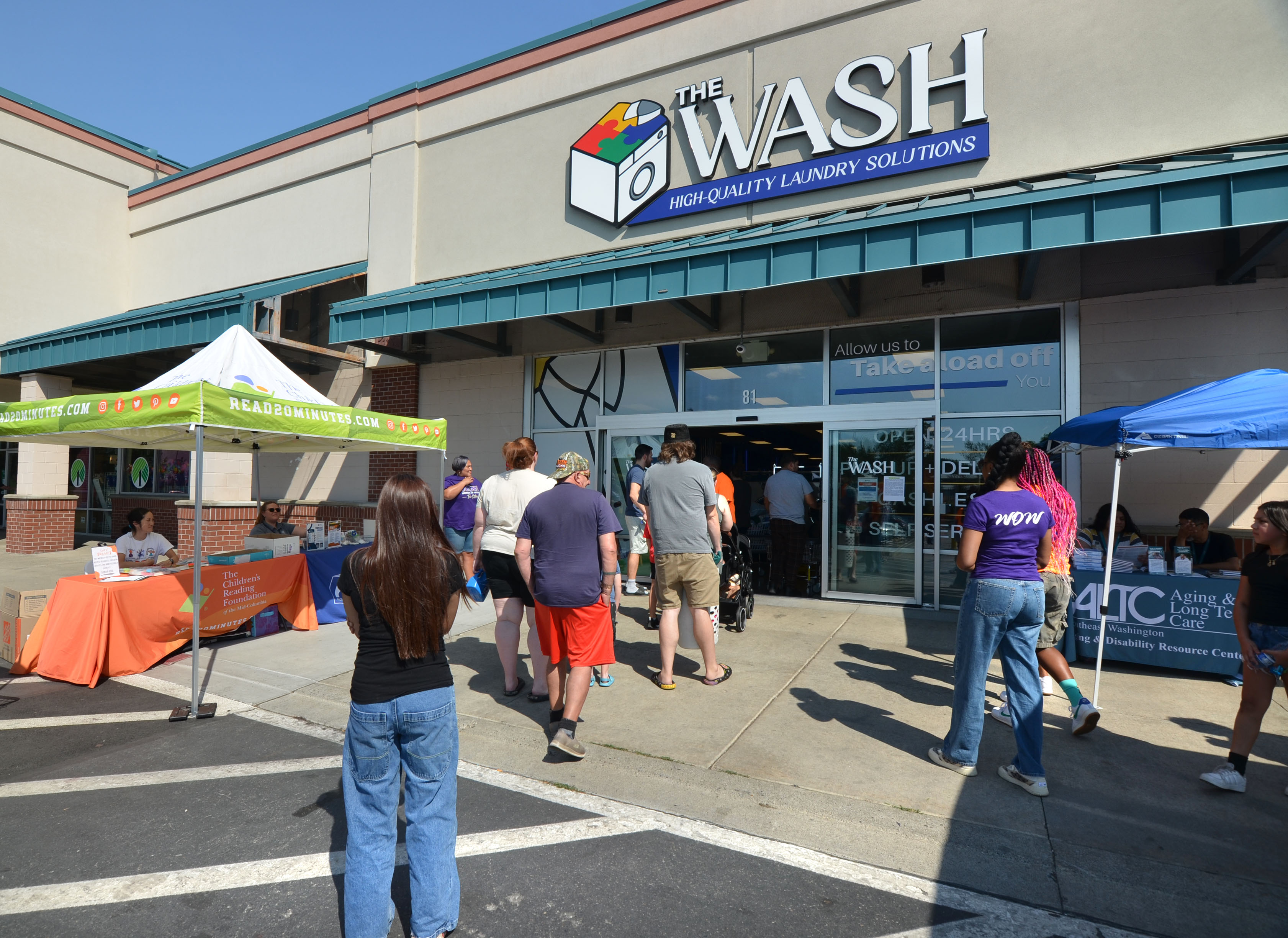 Visitors outside The Wash in Richland during Free Laundry Day