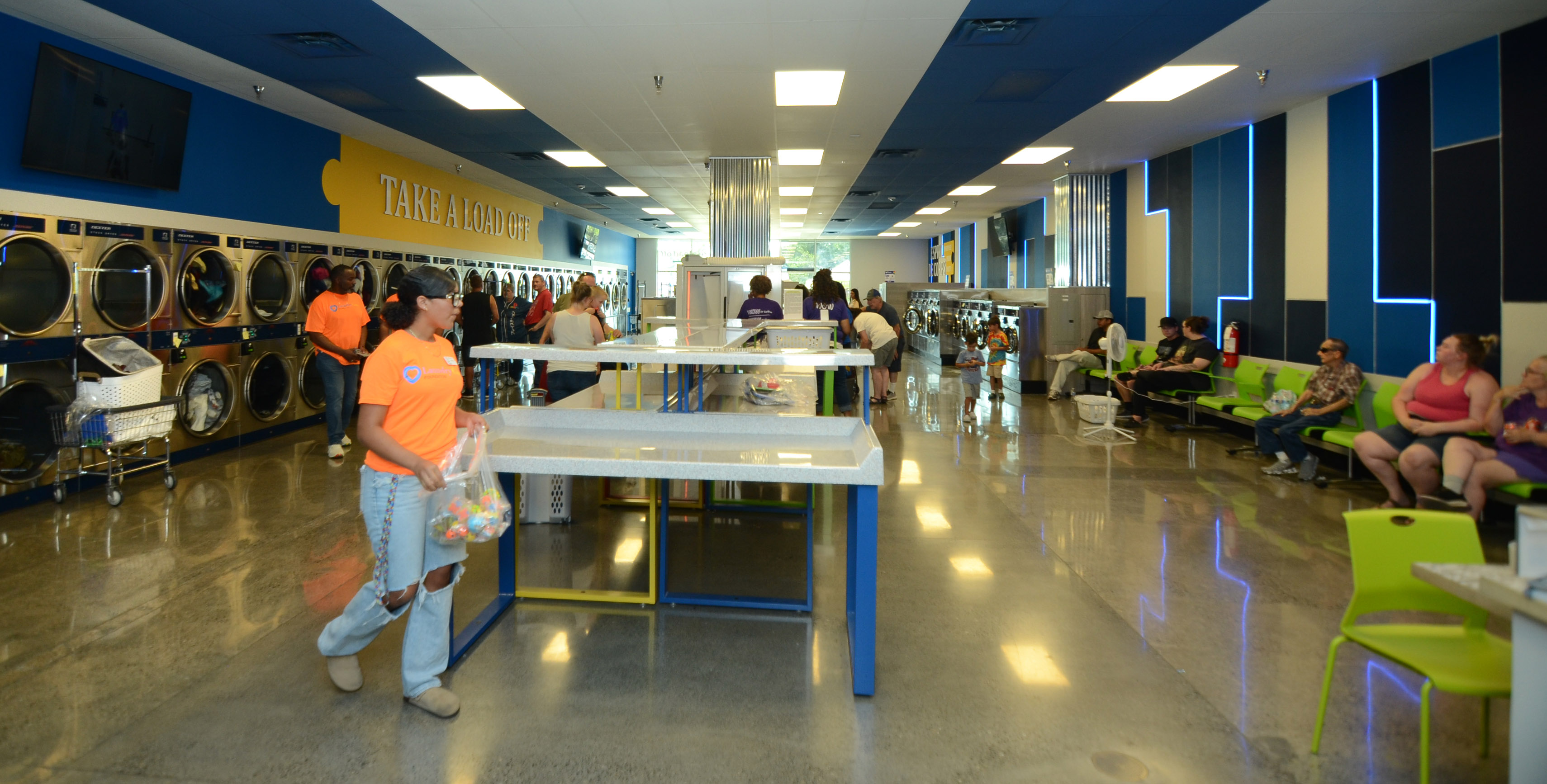 Professional photograph of The Wash interior with washers and folding tables